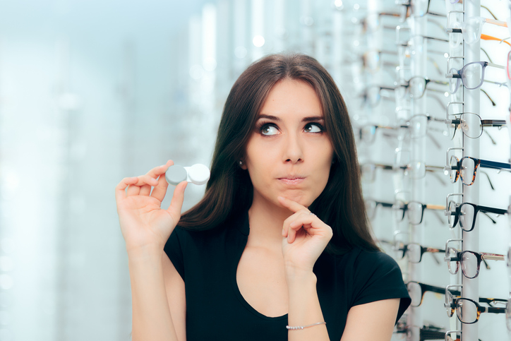 Girl considering the advantages and disadvantages of wearing contacts | Diamond Vision