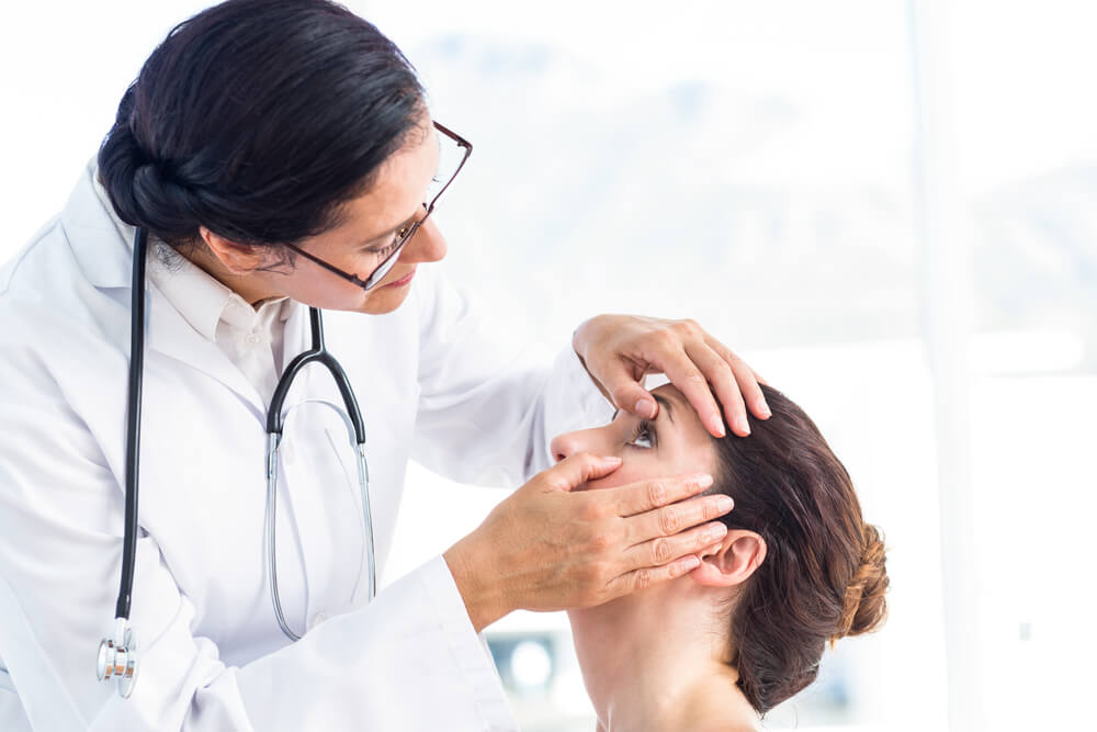 Doctor Checking Her Patients Eyes in Medical Office