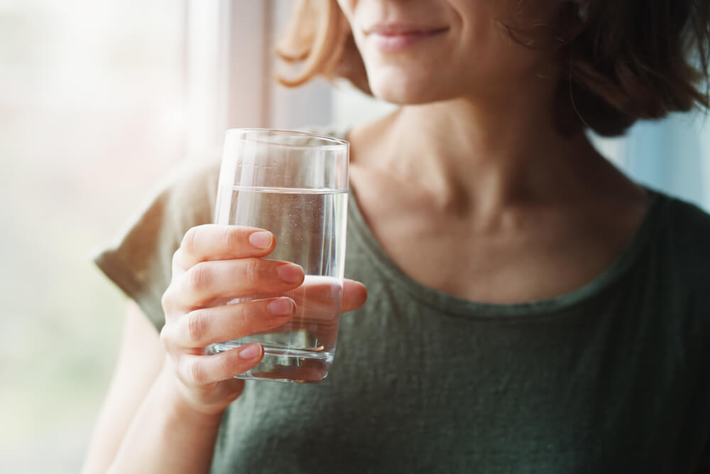 Healthy Beautiful Young Woman Holding Glass of Water | Diamond Vision