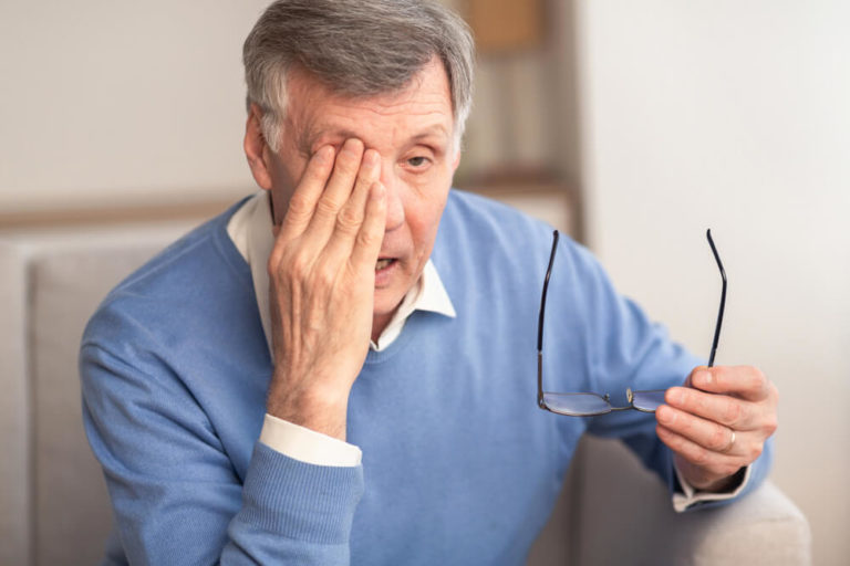 Tired Elderly Man Massaging Eye Holding Eyeglasses Having Eyestrain